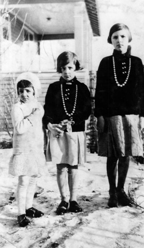 Sisters in front of home in Kipling, Saskatchewan