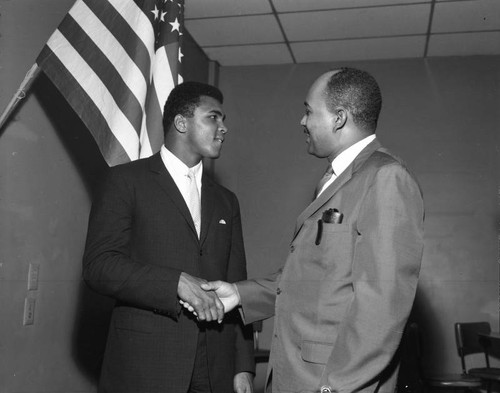Muhammad Ali and unidentified man at the NAACP Prexy Maxy Flier testimonial dinner