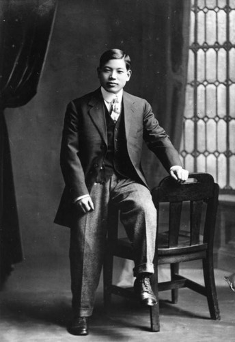 Japanese American man on chair