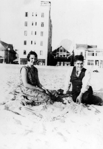 Lea Stoakin seated on the sand, Long Beach