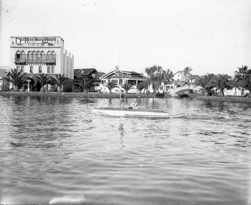 Small speed boat crossing the canal