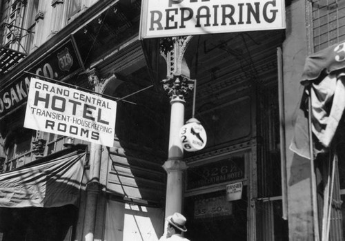 Signs at doorway to Grand Central Hotel