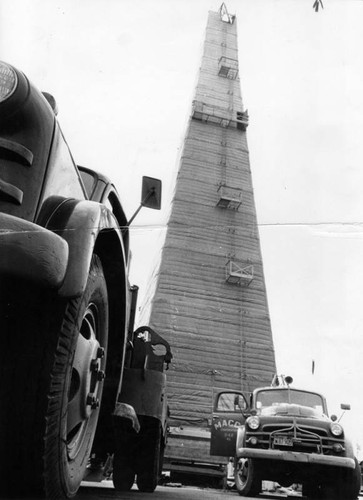 Oil derrick rises from the ground in Van Nuys