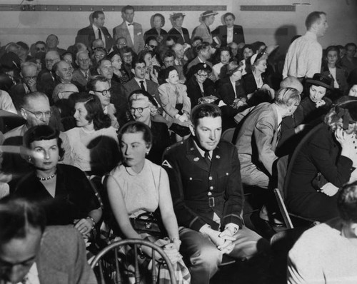 Spectators pack hearing room