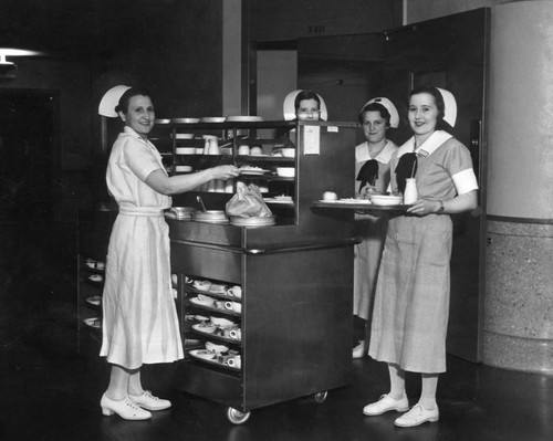 Nurses deliver meals at County Hospital