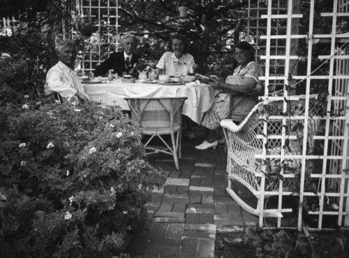 Herman and Ethel Schultheis, garden party at Mrs. Morton's Laguna Beach home