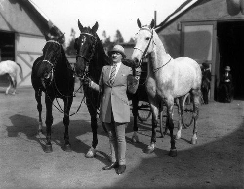 Mrs. A.C. Thompson and her horses