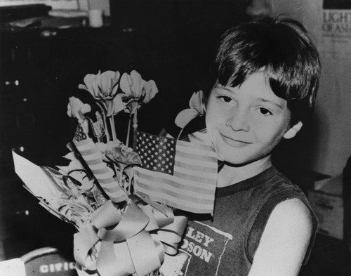 Mexican American boy with flowers