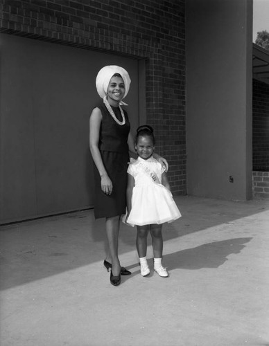 Woman with child wearing sash