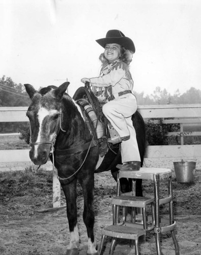 Valleys tiniest cowgirl limbers up pony for Santa Barbara Spanish Day Fiesta