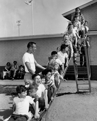 Slideful of youngsters, Normandie Playground