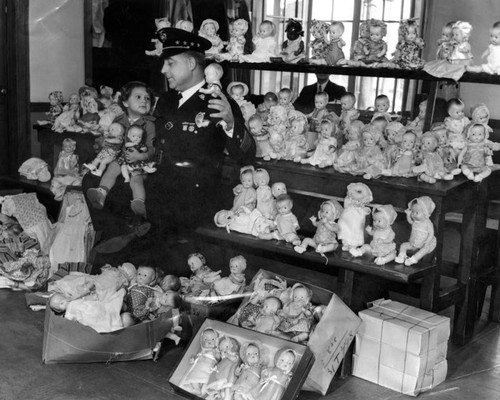 Police Chief Davis holding small child