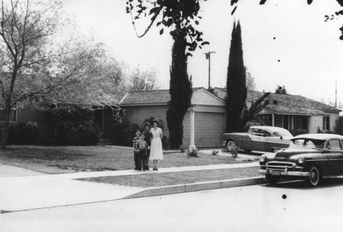 Family in front of home