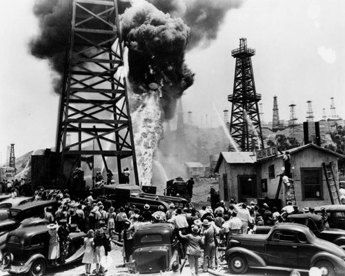 Crowds gather to watch oil fire