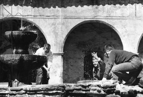 Fountain in front of the century-and-a-half-old Mission San Fernando becomes a play area for youngsters