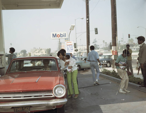 Cars pull up to the service station