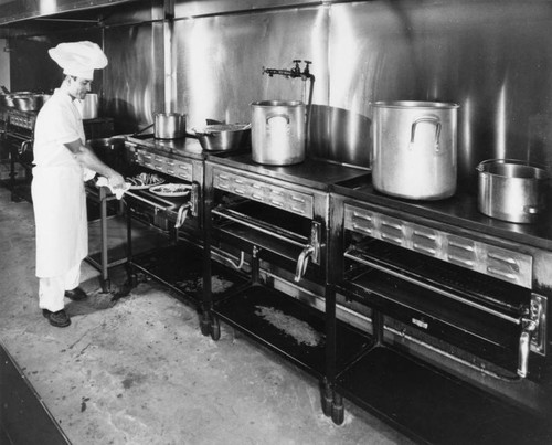 Mexican cook in kitchen