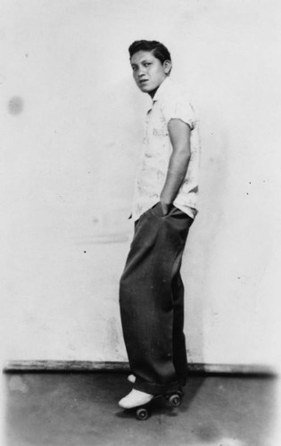 Mexican American boy on roller skates