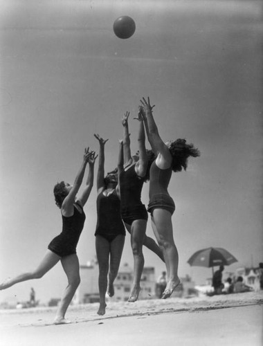 Women frolicking at Long Beach, view 1