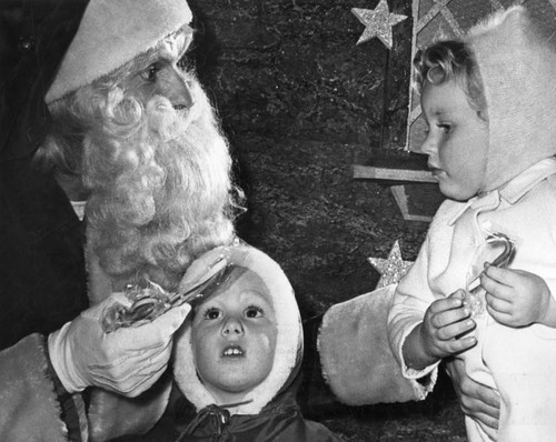 Santa Claus swaps candy for Christmas wishes