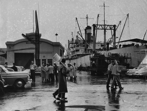 Police on guard as ship is picketed in rain