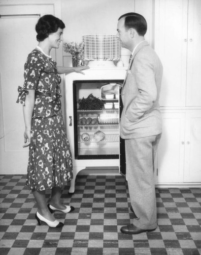 Woman looking at refrigerator