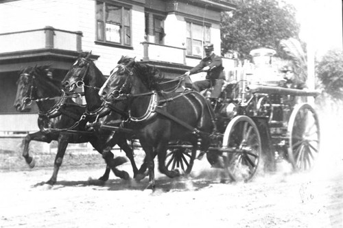 Horse-drawn fire engine answers fire call