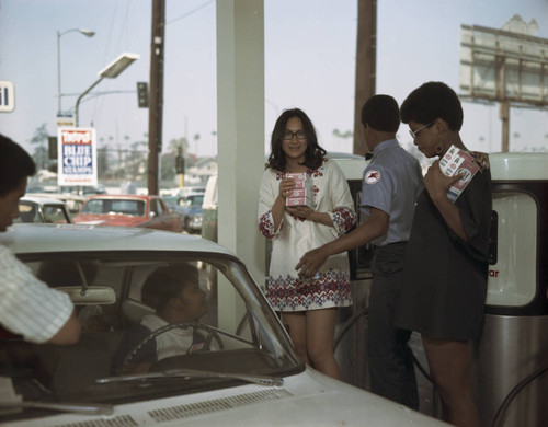 Women hold sugar boxes