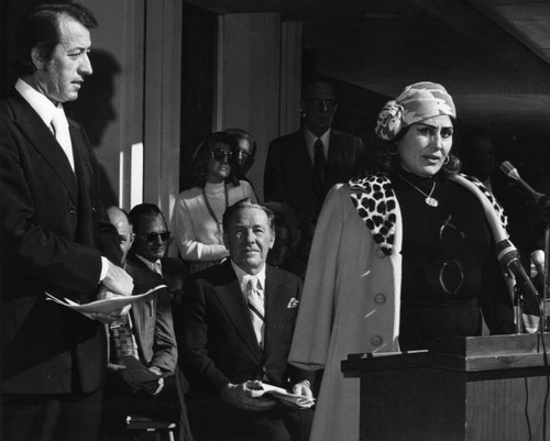 Woman speaking at library name dedication