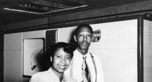 Couple in their dry cleaner shop