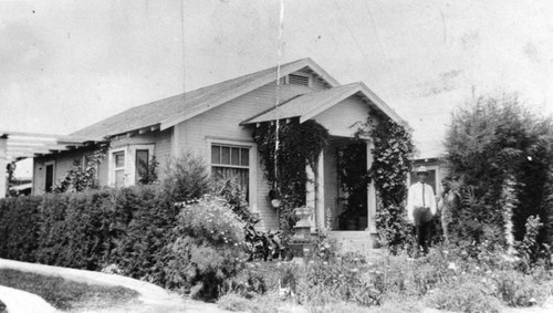 Mexican American brothers in front of home