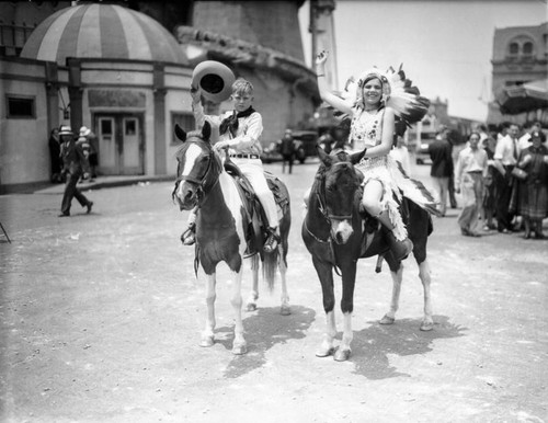 Young cowboy and Indian on parade