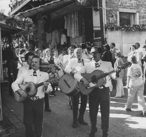 Mariachi band serenading Rose queen