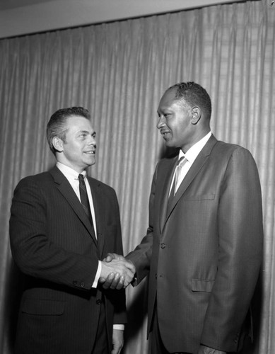 Tom Bradley and unidentified man