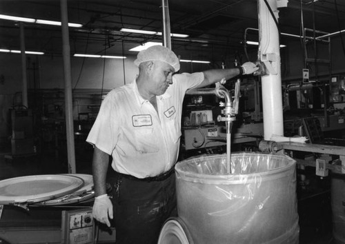 Filling mustard barrels, Walker Foods, Inc