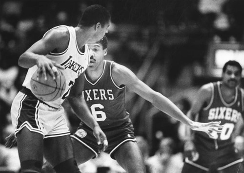 Dr. J. guards against Magic Johnson