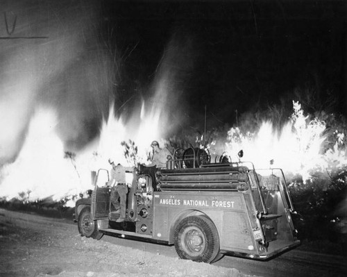 Forest service truck crew watches Texas Canyon fire line