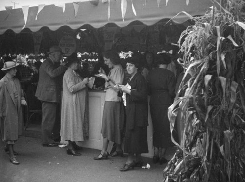 Ethel Schultheis eating with friends at the Farmers Market Fall Festival