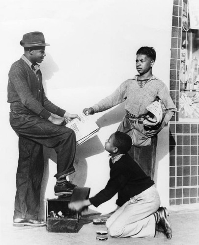 Shoeshine and newspaper boys at work