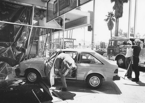 Drug store damaged by crash