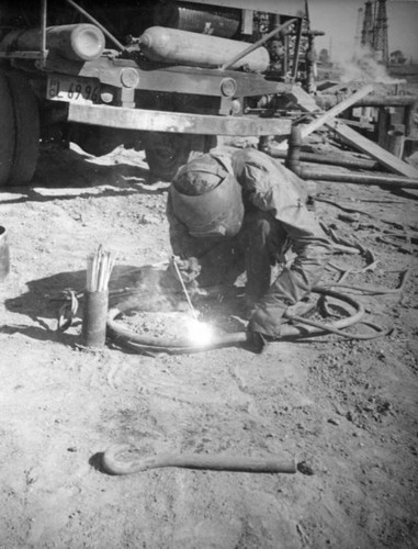 Repairing a pipe in the Montebello oil field