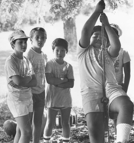 Young campers enjoying rope swing