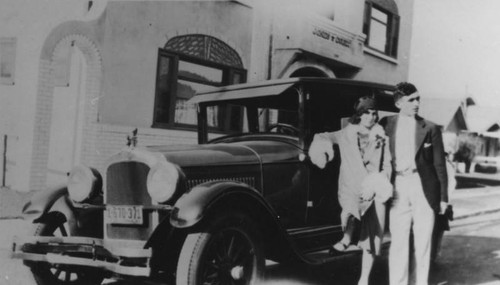 Couple next to car