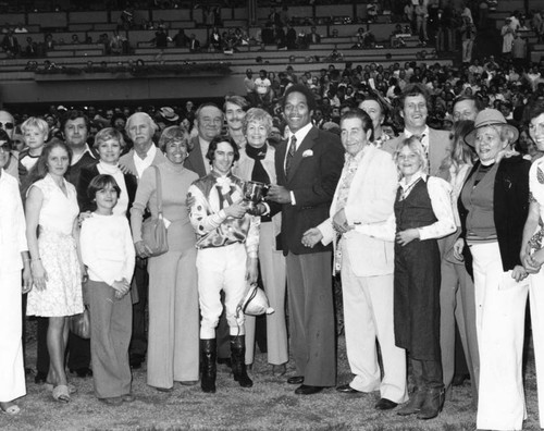 O. J. Simpson presents trophy