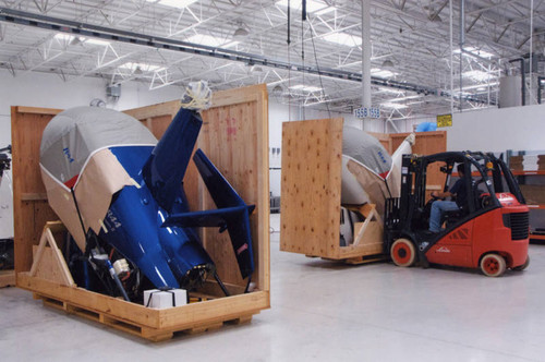 Helicopters crated for shipment