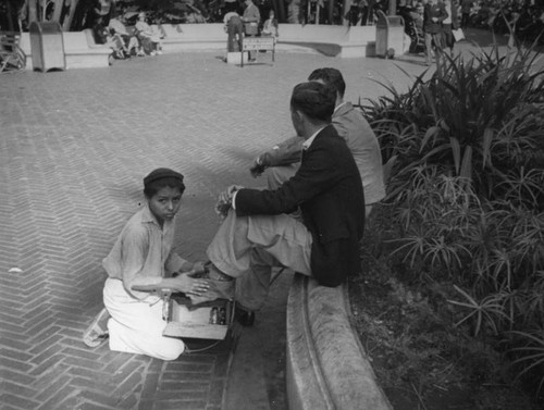 Young shoeshine boy at Pershing Square