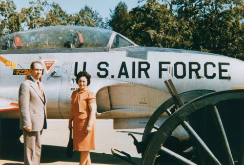 Iranian Americans next to airplane