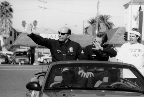 Two policemen in parade car