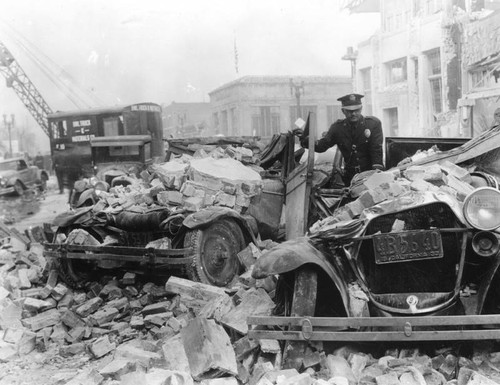 Cars covered with earthquake debris