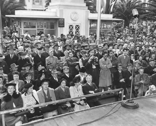 Crowd watches pageant, Victory House